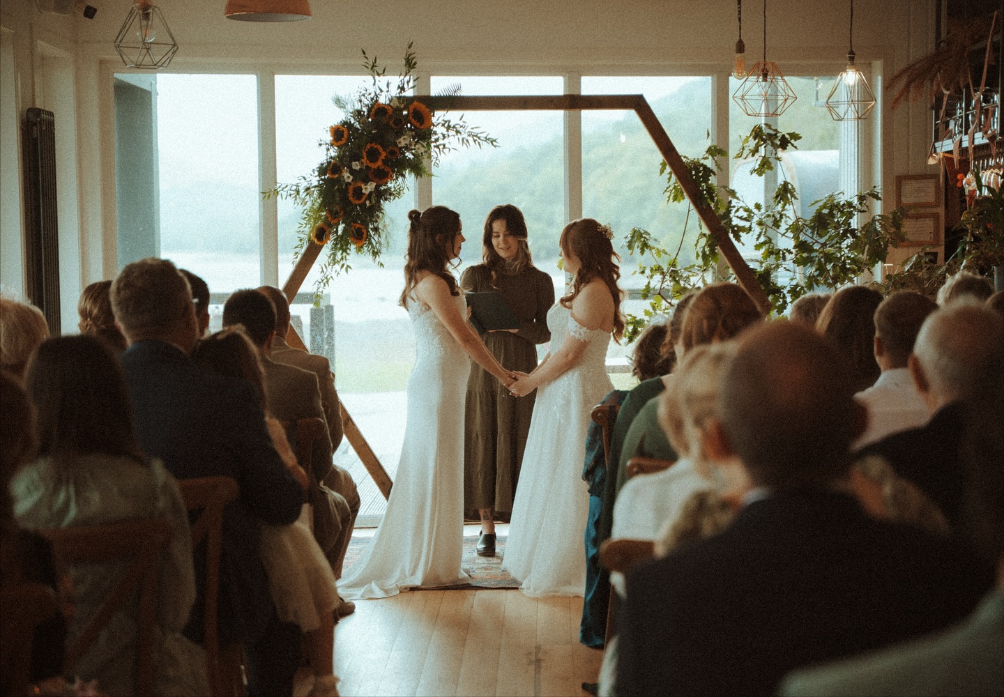 Indoor ceremony in front of the panoramic glass façade
