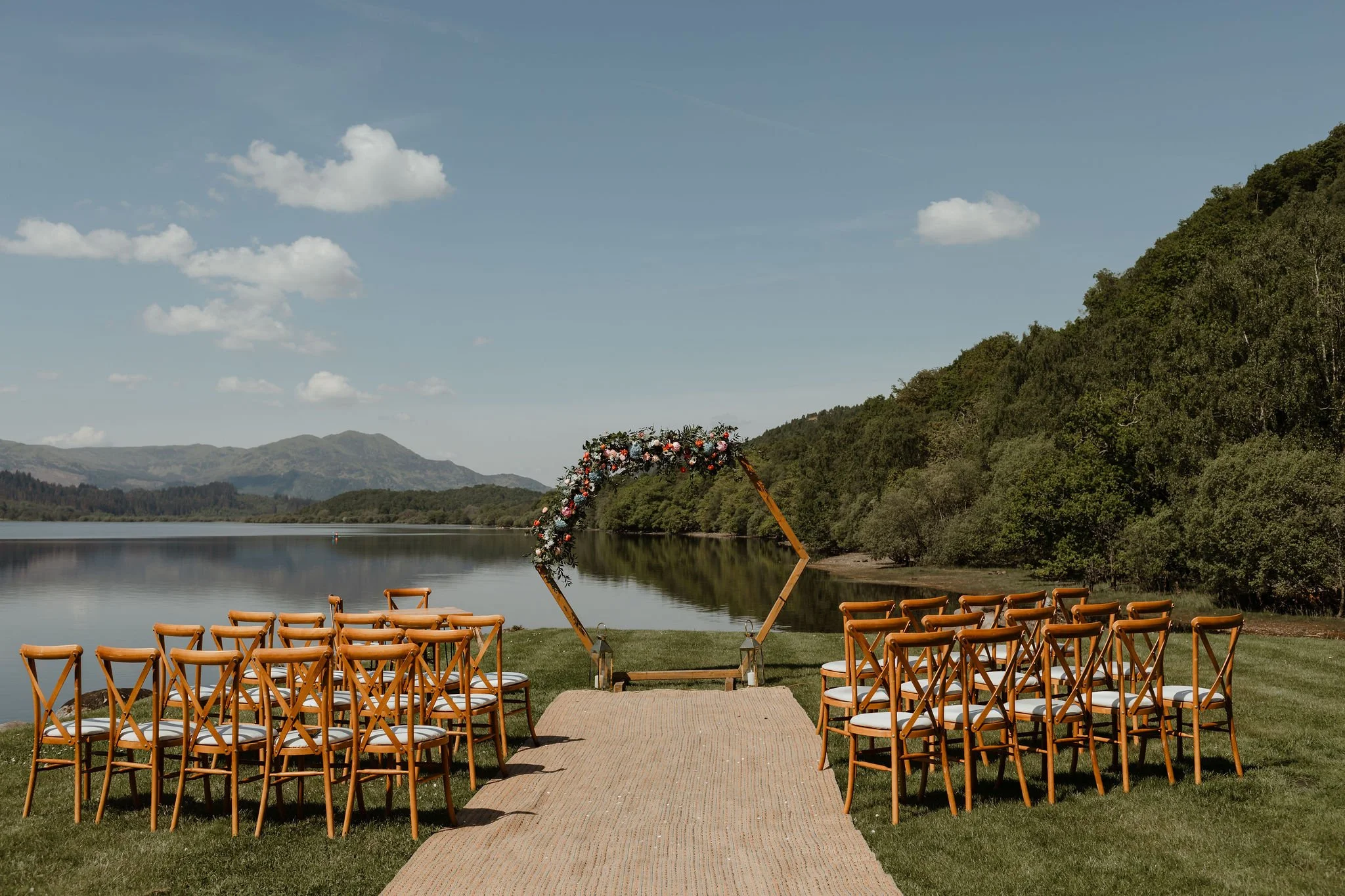 Lawn ceremony with arch